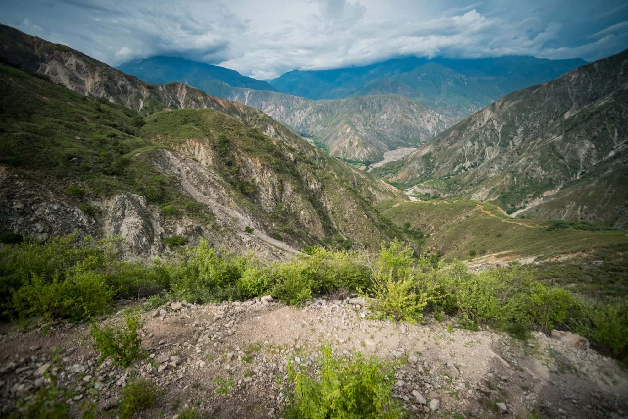 Trail dropping toward the floor of the Chicamocha Canyon between mountains