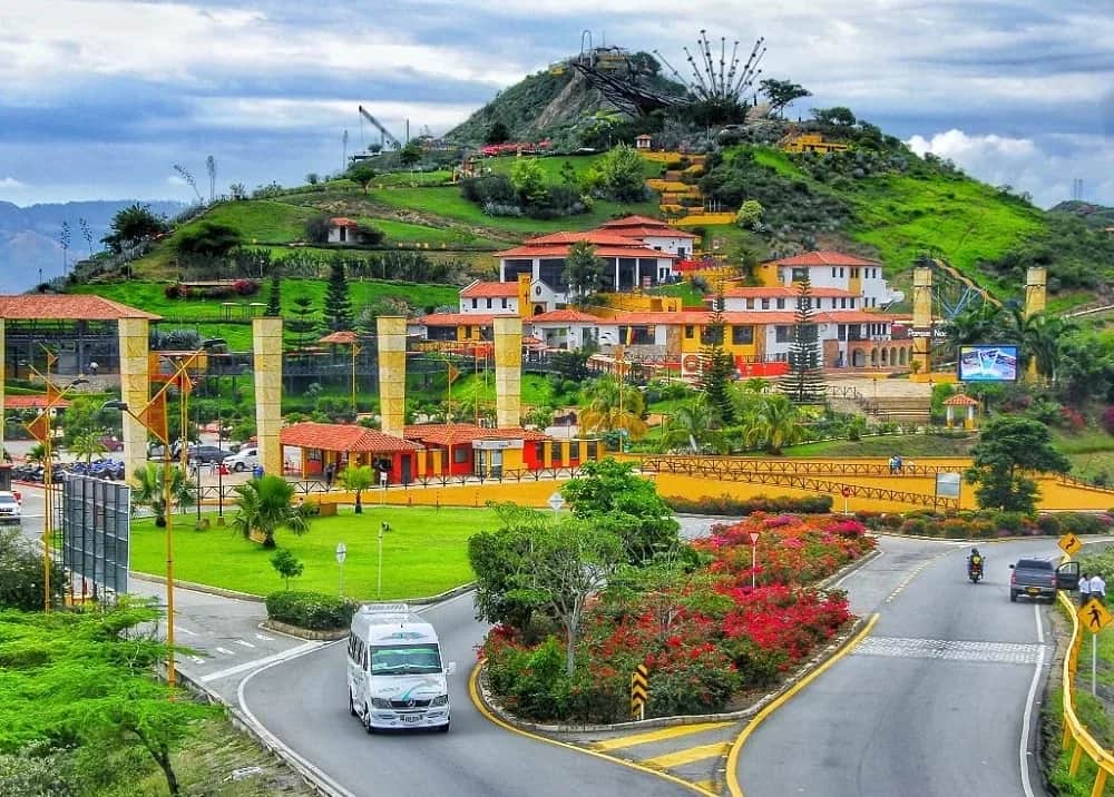 Hill with a monument and buildings at Chicamocha National Park, surrounded by gardens and roads