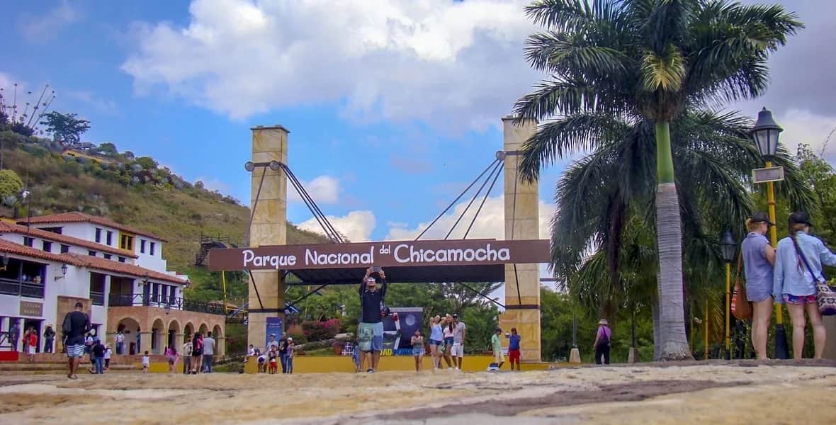 Entrance to Chicamocha National Park, with visitors and palm trees