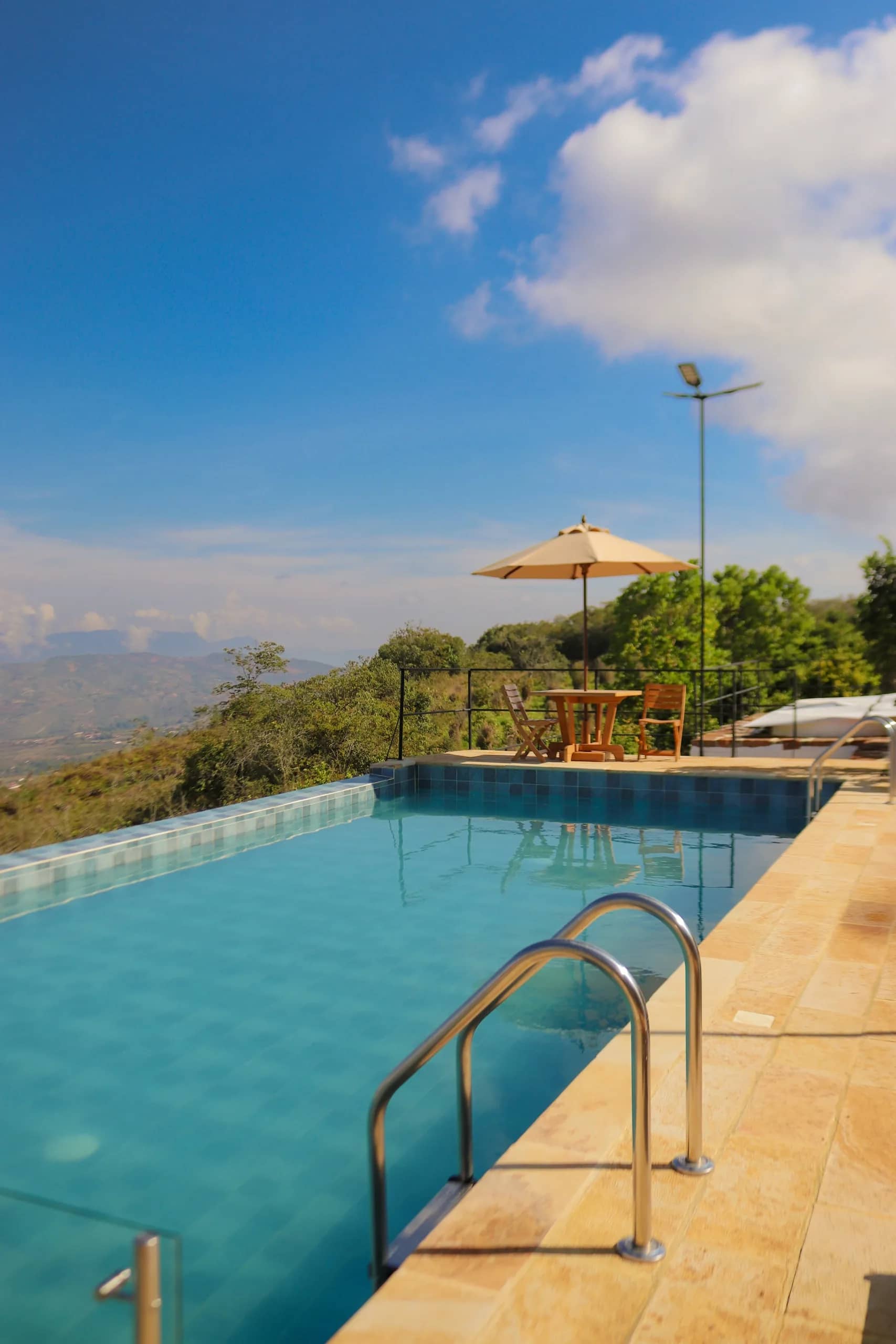 Pool with panoramic mountain views at Hotel Carigua Barichara