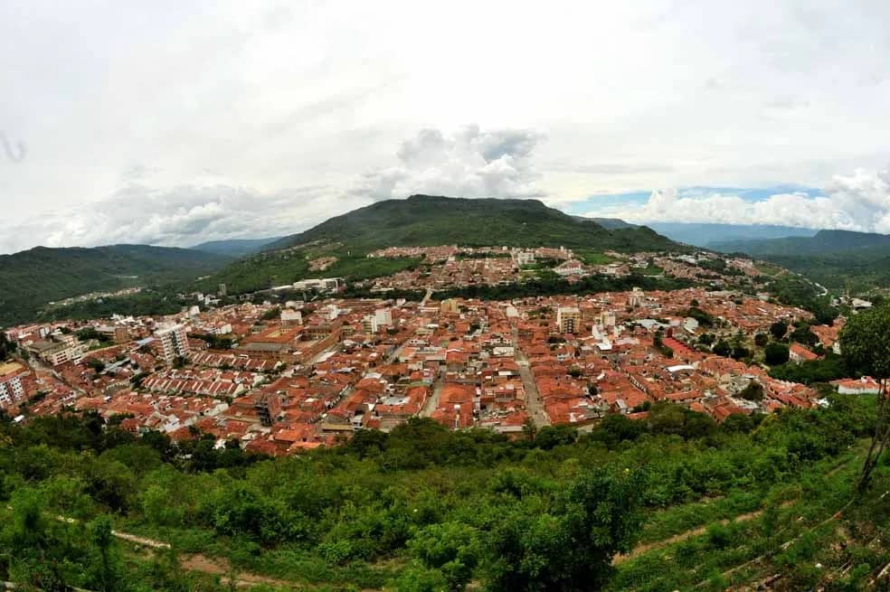 Panoramic view of San Gil, its tiled roofs set among green mountains