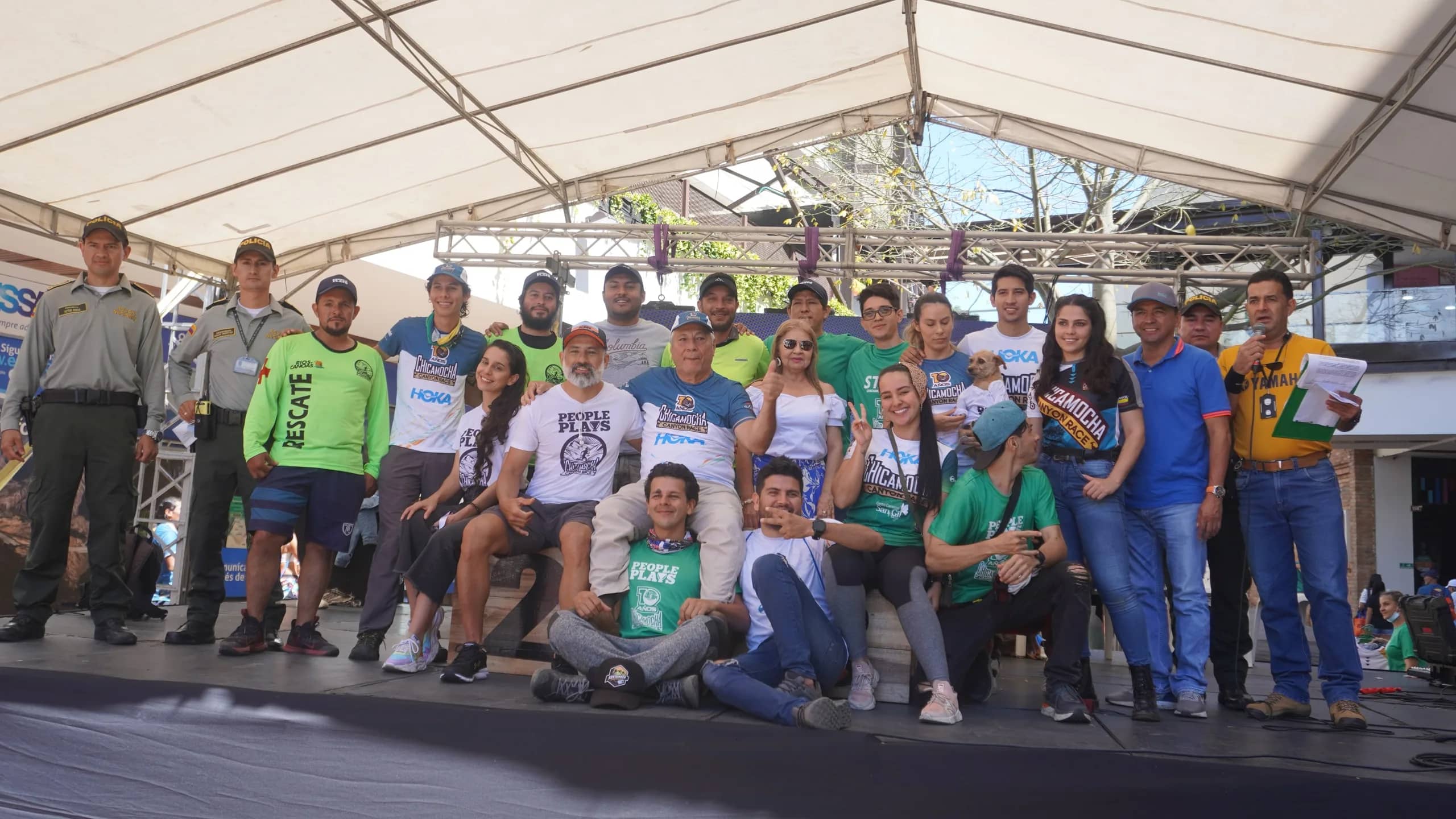 Race team, including staff, rescue crew and police officers, gathered on the event stage